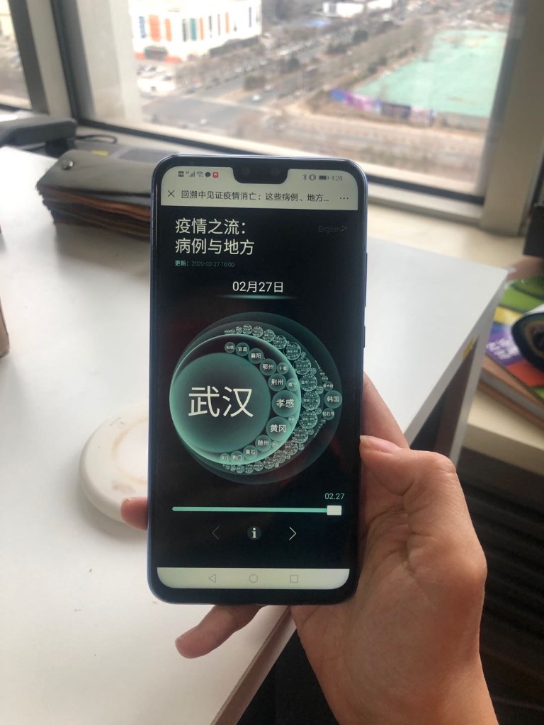 A hand holding a phone showing CaseFlow during early COVID-19 isolation